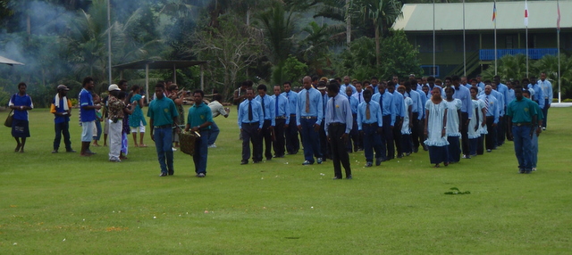 Graduating students march up to ceremony area