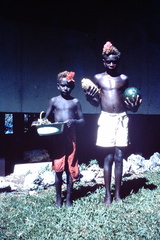 1961 April - 2 boys bring fruit from Mara Launa